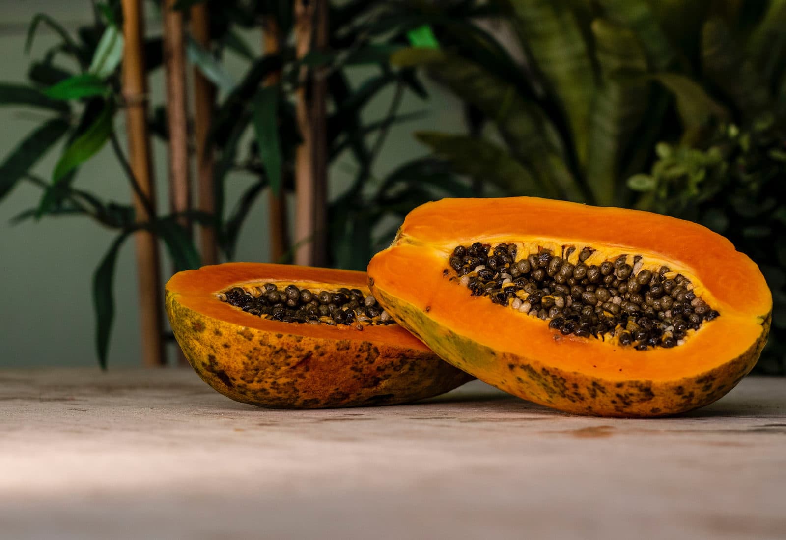 A ripe papaya, halved
