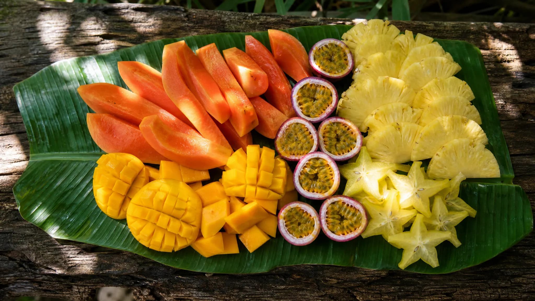 Seasonal fruit served on banana leaf